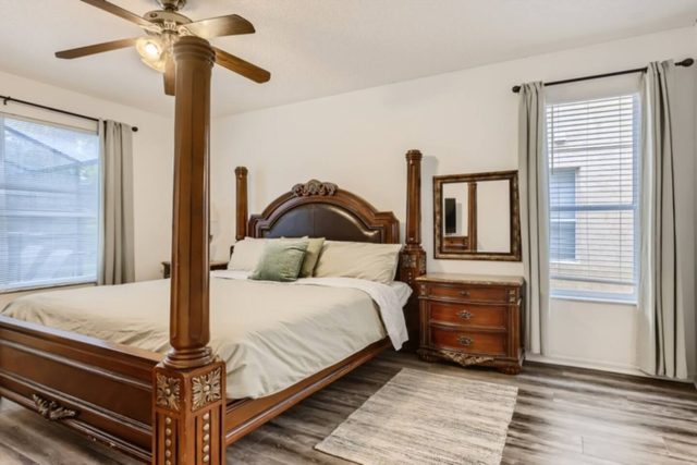 Heroes & Wizards Villa, Master bedroom with King bed large flat screen TV, and private bathroom with tub and shower