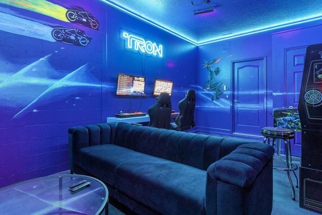 Pixel & Pixie Retreat, The Tron game room and movie room, featuring two classic game stations and large smart TV for watching movies!