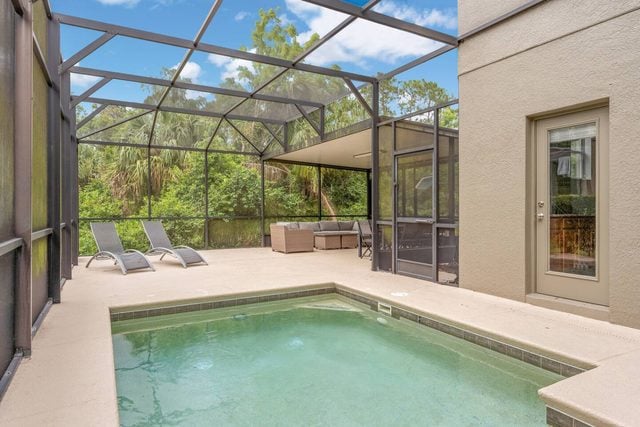 Pixel & Pixie Retreat, Private pool deck with comfortable seating, lounge chairs, and dining table.