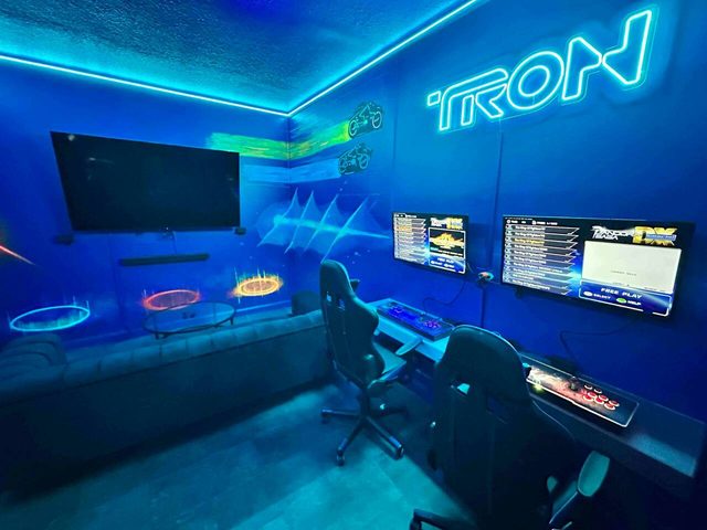Pixel & Pixie Retreat, The Tron game room and movie room, featuring two classic game stations and large smart TV for watching movies!