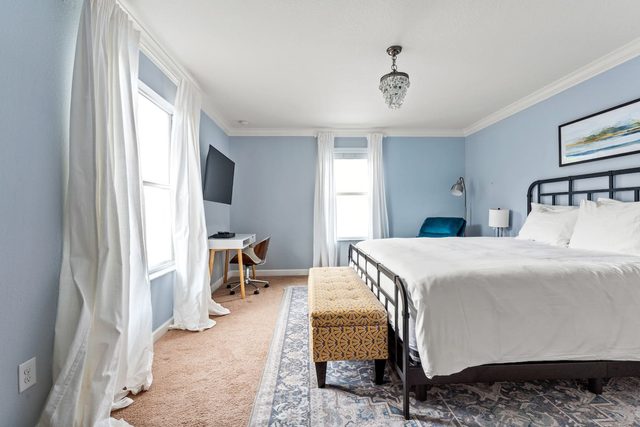 Pixel & Pixie Retreat, Upstairs master bedroom with king size bed, large smart tv and private ensuite bathroom