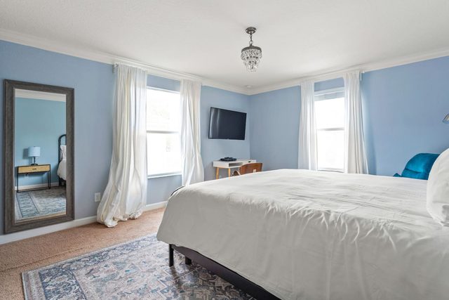 Pixel & Pixie Retreat, Upstairs master bedroom with king size bed, large smart tv and private ensuite bathroom