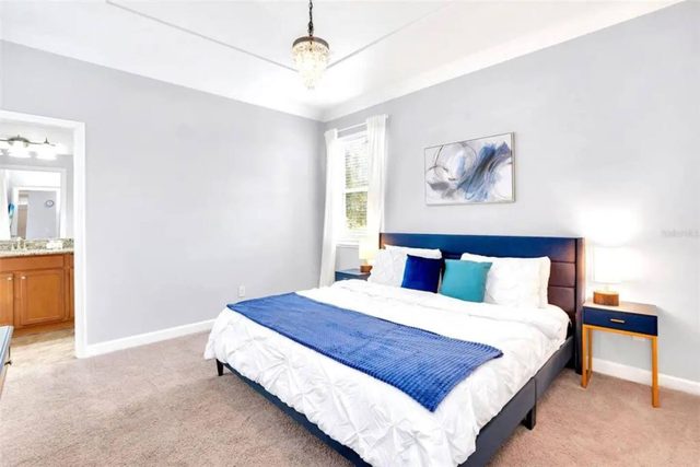 Pixel & Pixie Retreat, Downstairs master bedroom with king size bed, large smart tv and private ensuite bathroom leading out to the pool.