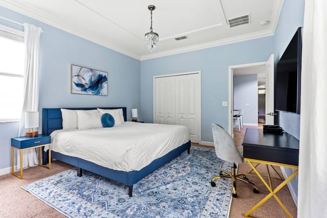 Pixel & Pixie Retreat, Downstairs master bedroom with king size bed, large smart tv and private ensuite bathroom leading out to the pool.