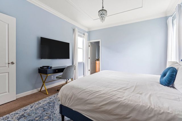 Pixel & Pixie Retreat, Downstairs master bedroom with king size bed, large smart tv and private ensuite bathroom leading out to the pool.