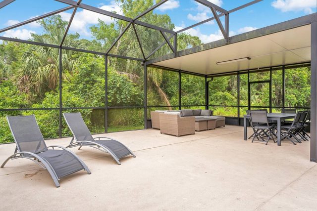 Pixel & Pixie Retreat, Private pool deck with comfortable seating, lounge chairs, and dining table.
