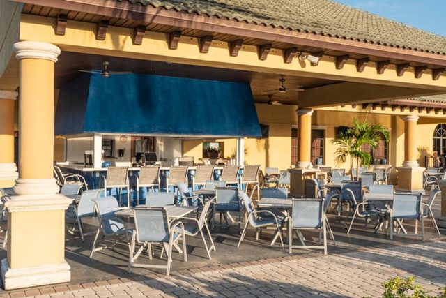 Pixel & Pixie Retreat, Clubhouse bar and grill. The Paradise Palms clubhouse with large swimming pools, grotto spa, splash pad for the kids, tennis courts, movie theater cinema, fitness center and more!