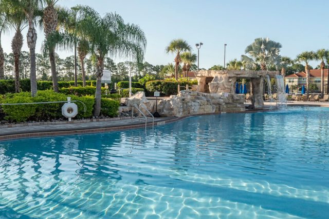 Pixel & Pixie Retreat, The Paradise Palms clubhouse with large swimming pool, grotto spa, splash pad for the kids, tennis courts, movie theater cinema, fitness center and more!
