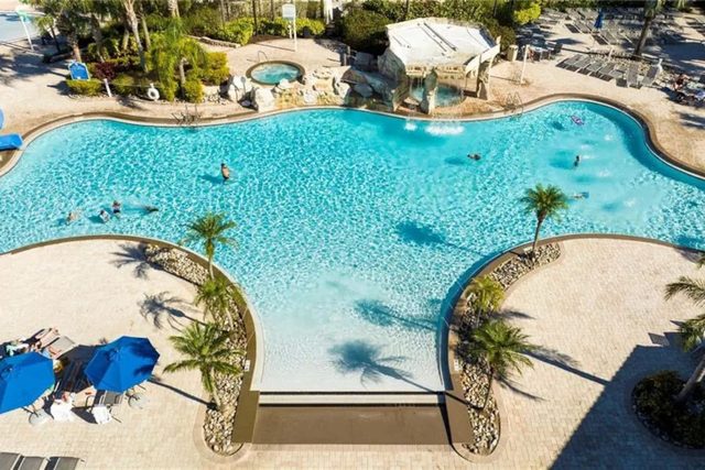 Pixel & Pixie Retreat, The Paradise Palms clubhouse with large swimming pools, grotto spa, splash pad for the kids, tennis courts, movie theater cinema, fitness center and more!