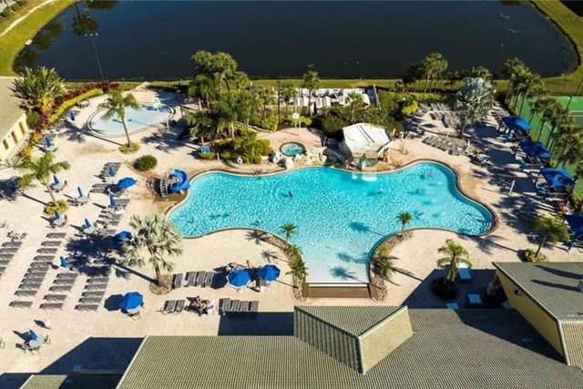 Pixel & Pixie Retreat, The Paradise Palms clubhouse with large swimming pools, grotto spa, splash pad for the kids, tennis courts, movie theater cinema, fitness center and more!