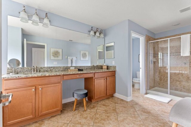 Pixel & Pixie Retreat, Master bathroom with individual shower and tub