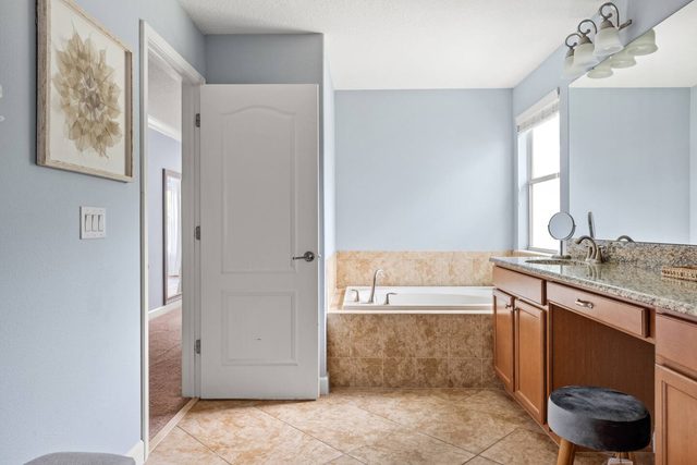 Pixel & Pixie Retreat, Master bathroom with individual shower and tub