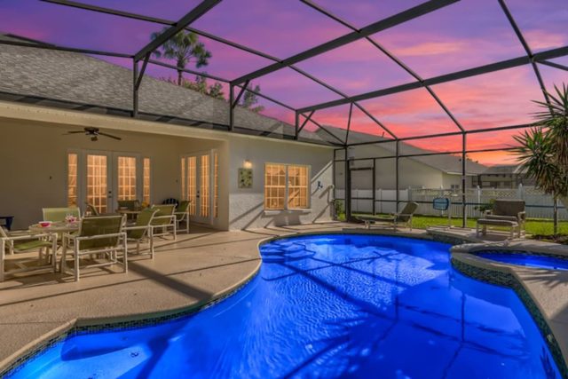 The Marvel Mansion, Patio pool deck with outdoor dining and seating and large private fenced backyard