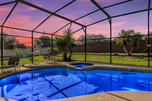 The Marvel Mansion, Patio pool deck with outdoor dining and seating and large private fenced backyard