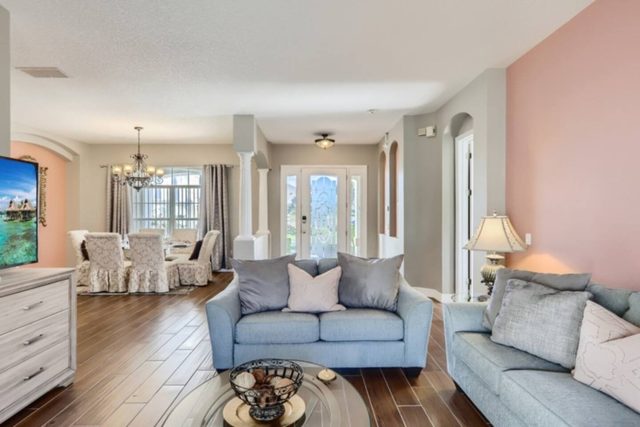 The Marvel Mansion, Living room 2 with large smart tv and doors out to pool and patio