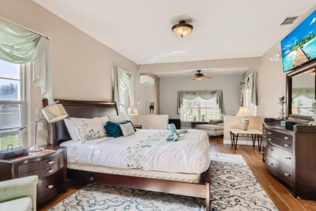 The Marvel Mansion, Master bedroom with king bed, work area, and ensuite private attached bathroom