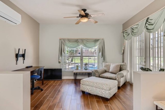 The Marvel Mansion, Master bedroom with king bed, work area, and ensuite private attached bathroom