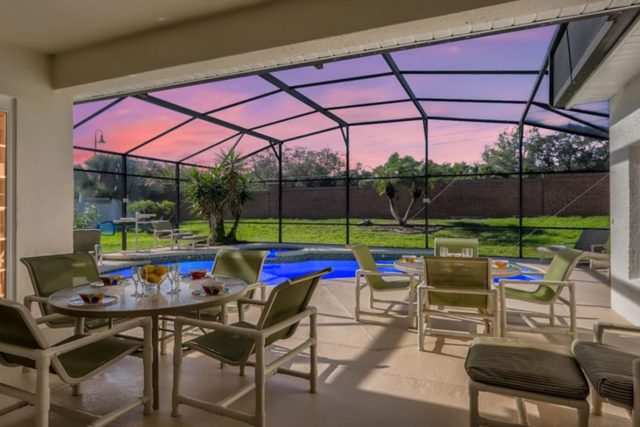 The Marvel Mansion, Patio pool deck with outdoor dining and seating and large private fenced backyard