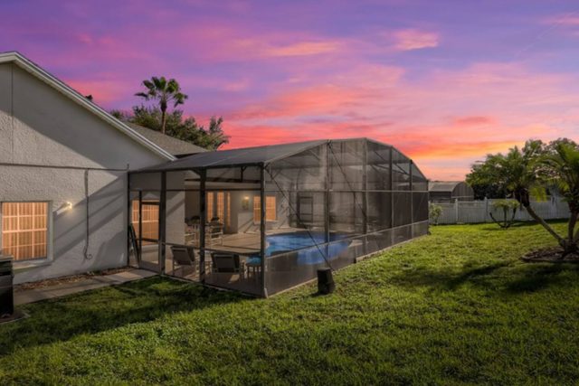 The Marvel Mansion, Patio pool deck with outdoor dining and seating and large private fenced backyard